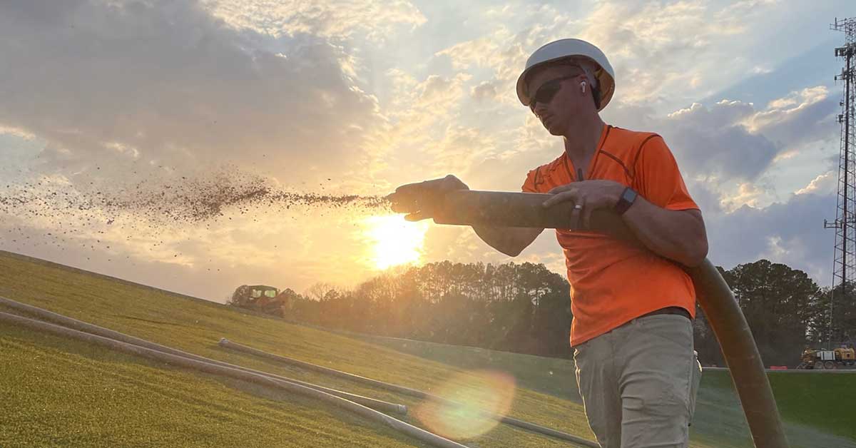 Superior Groundcover crew hydroseeding at sunset